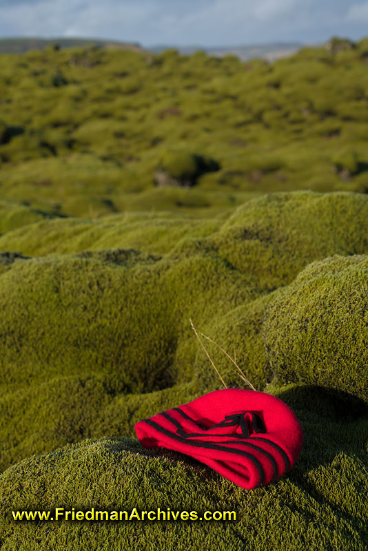 moss,green,rolling,hills,lava,texture,red,hat,contrast,color,green,
